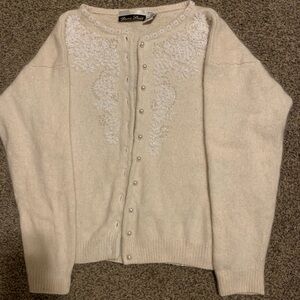 This is a vintage Dana Scott white angora and wool blend cardigan
